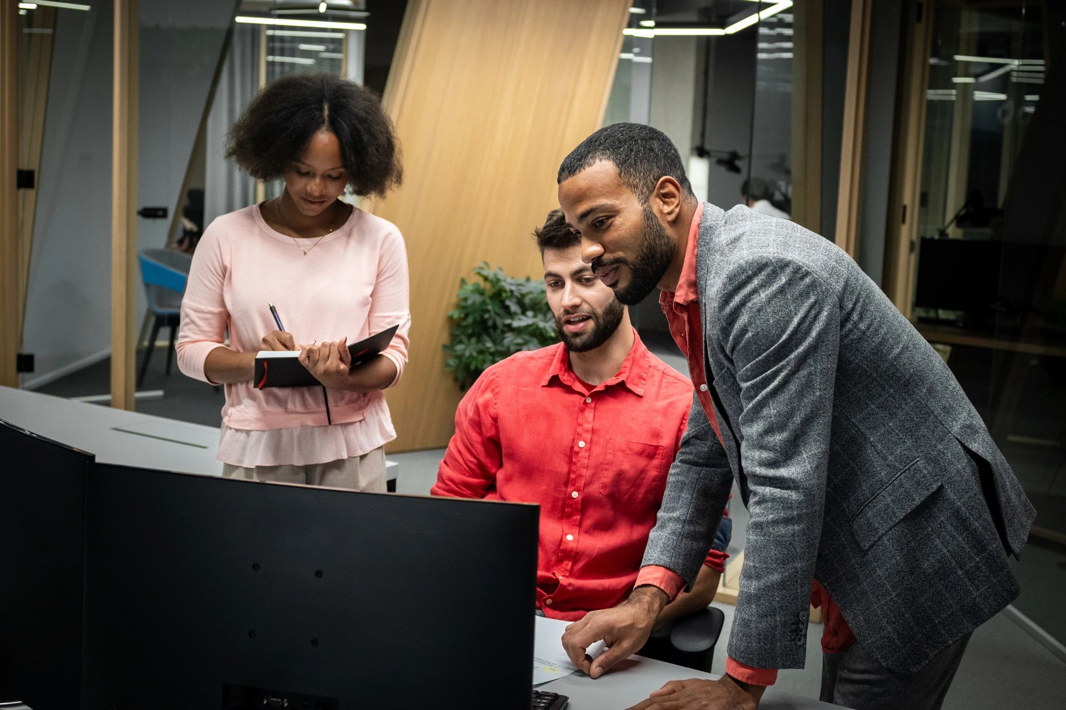 diverse IT professionals collaborating in modern office